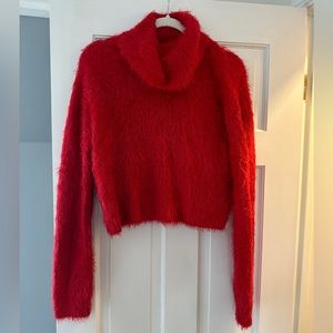 Bright red, medium fuzzy sweater